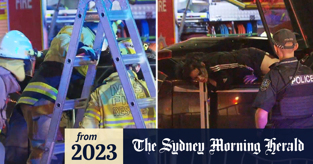 Video Woman Crashes Car Allegedly Threatens Emergency Responders With Axe